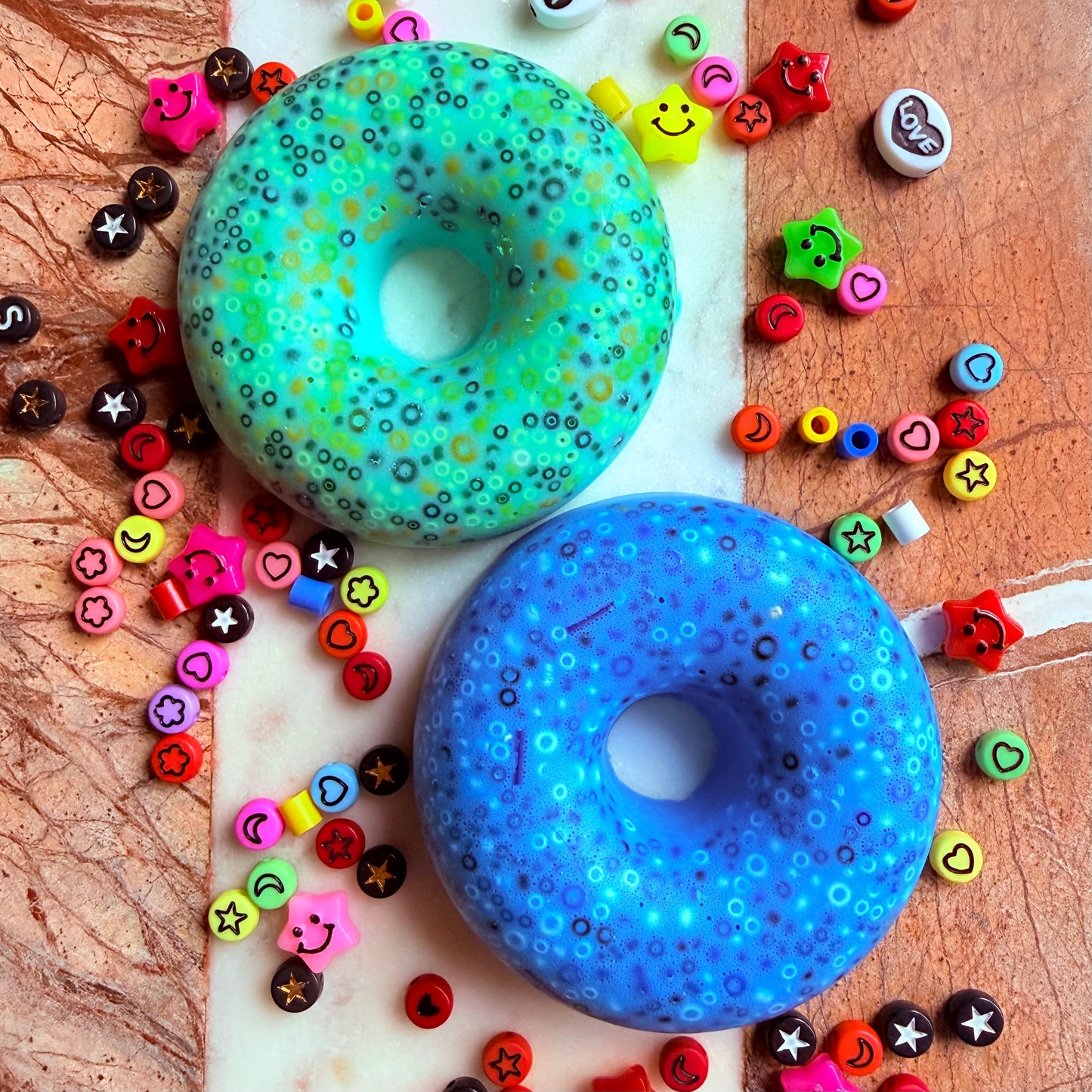 Colourful doughnut picky pad sensory fidget toy available in multiple colours