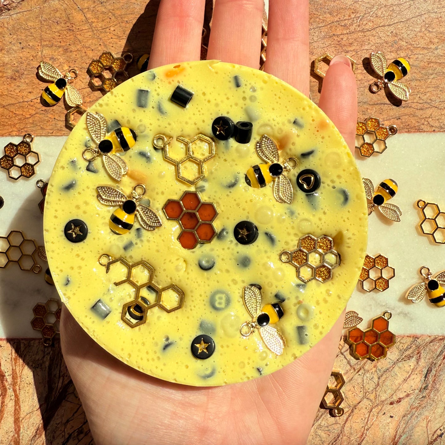 10cm beehive picky pad sensory toy shown in hand for size reference