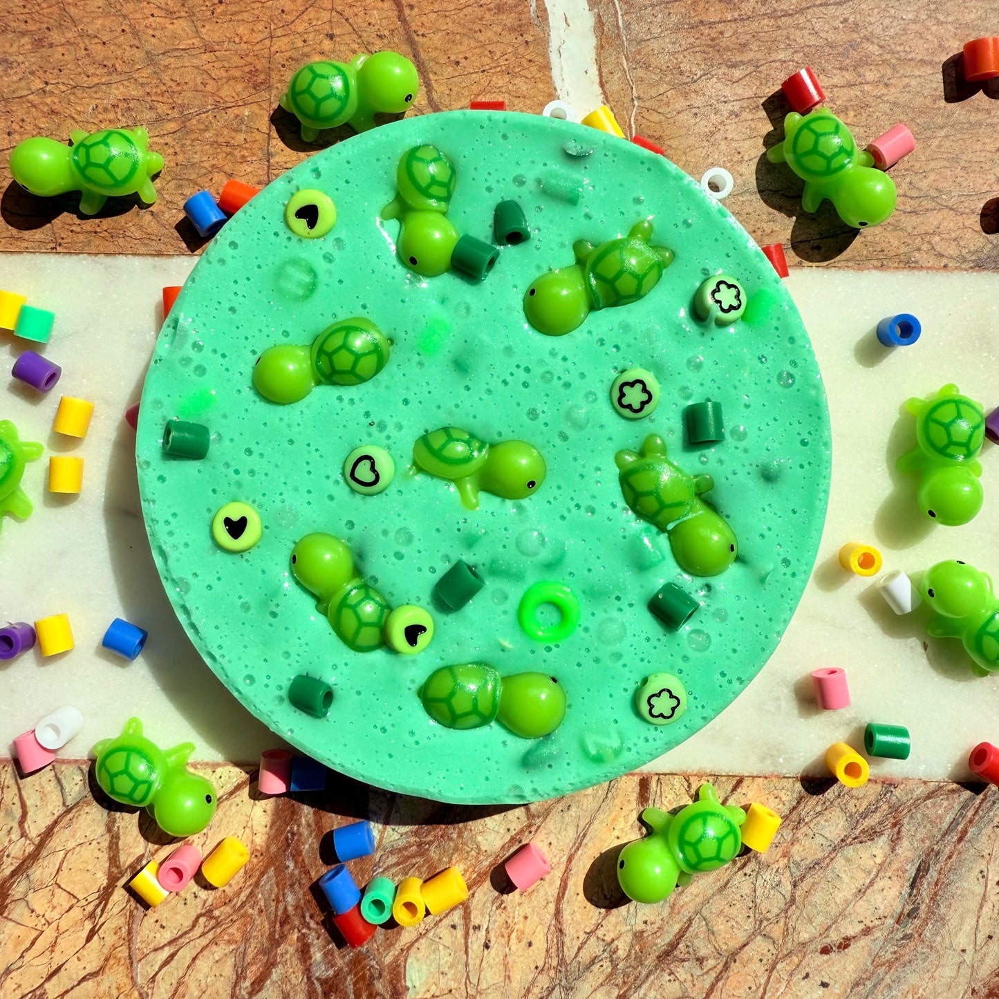 Turtle themed picky pad with green beads and turtle decorations
