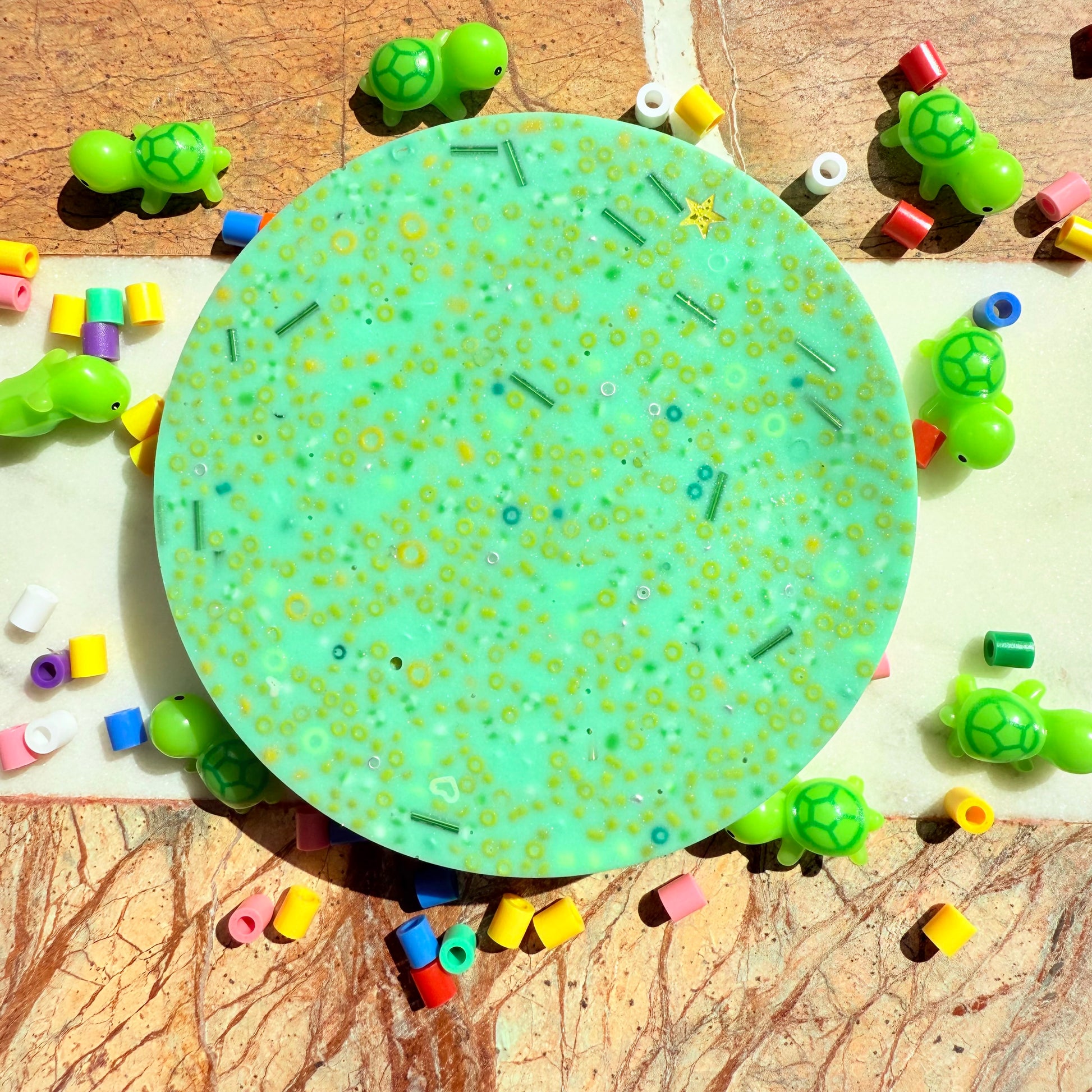 Close up of textured beads in remeltable turtle picky pad sensory toy