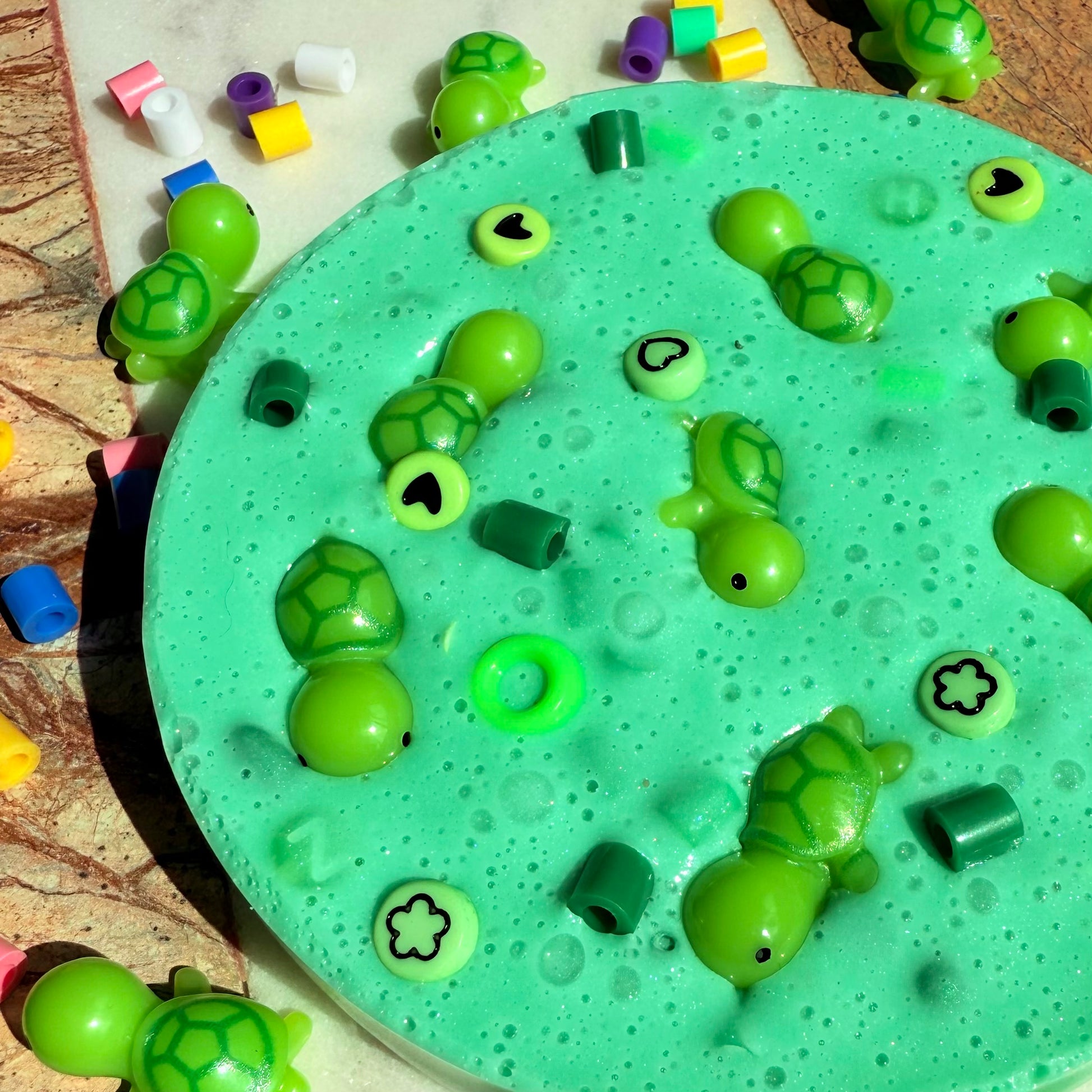 Turtle themed picky pad with green beads and turtle decorations