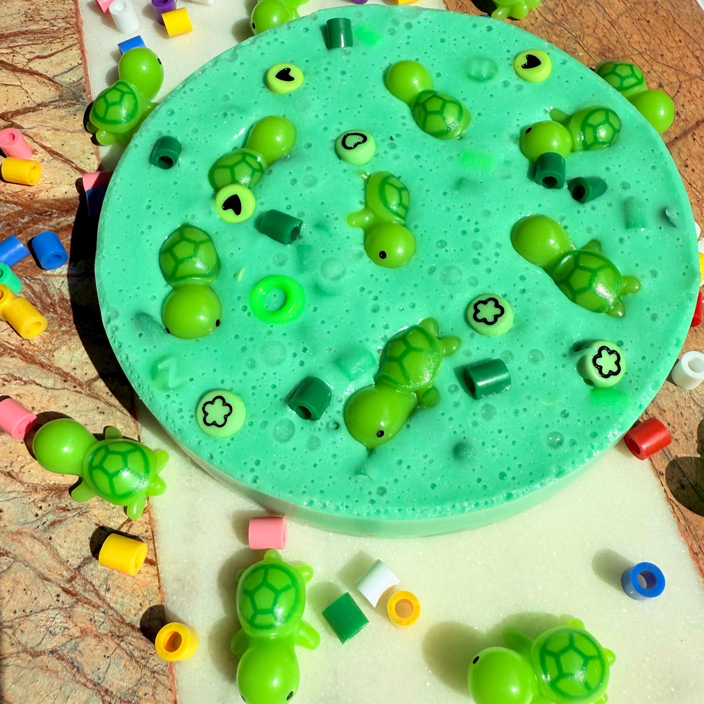 Turtle themed picky pad with green beads and turtle decorations