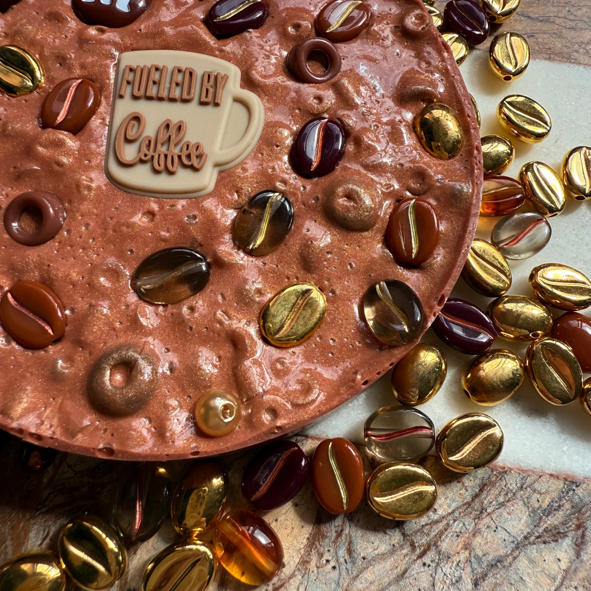 Close up of textured beads in remeltable coffee picky pad sensory toy