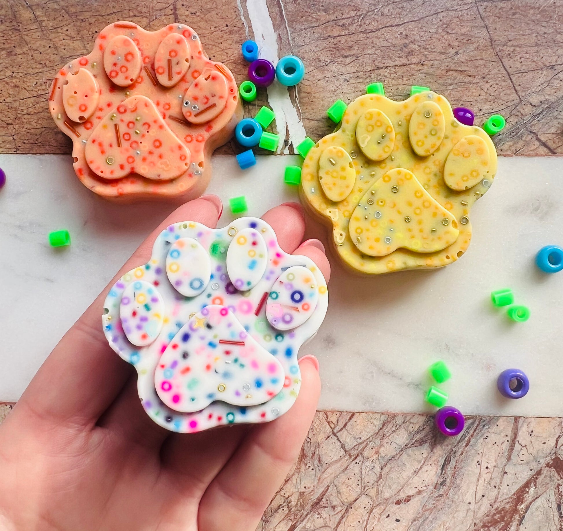 Small paw picky pad sensory toy shown in hand for size reference