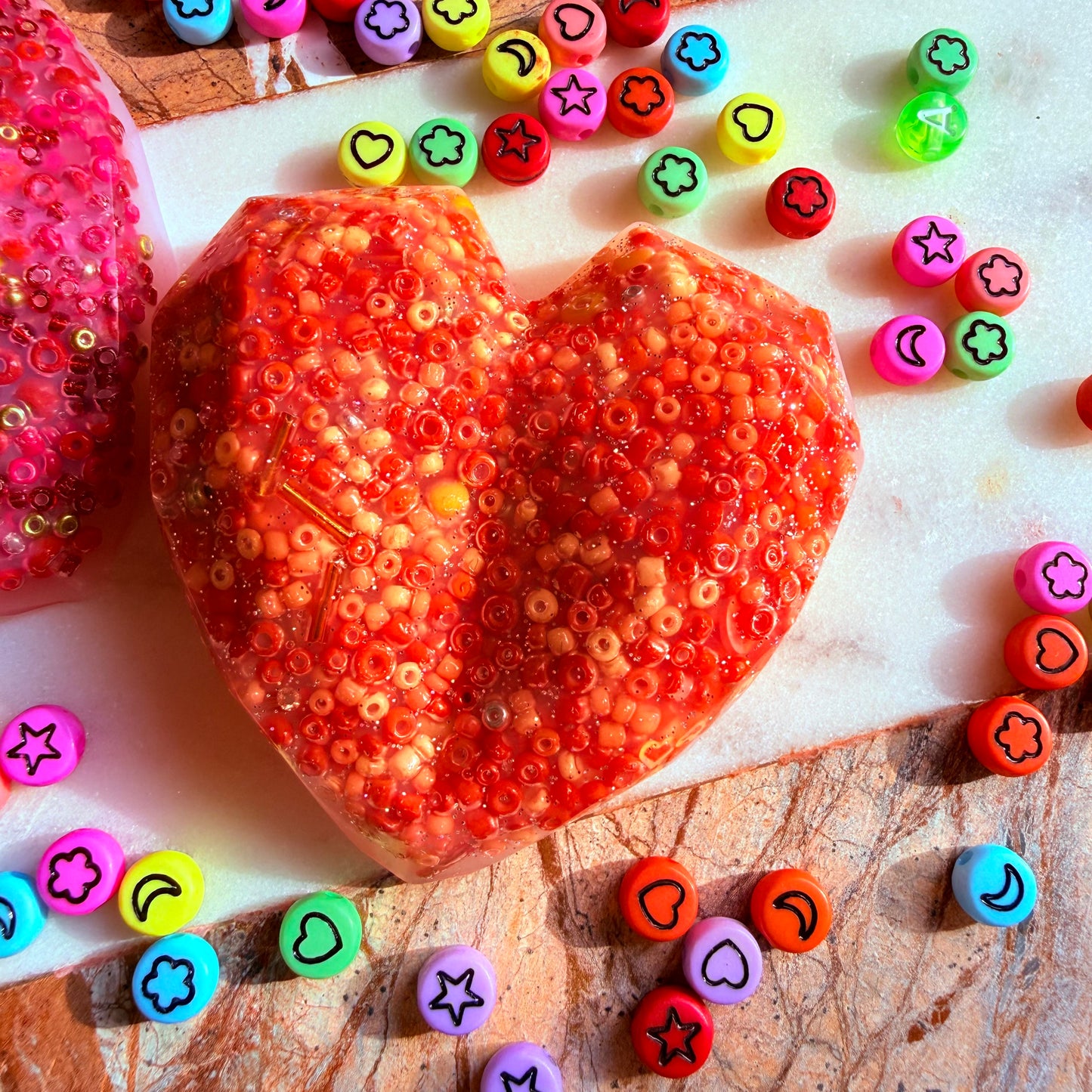 Colourful heart picky pad sensory fidget toy available in multiple colours